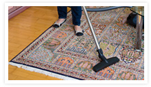House Cleaning, Franklin, MA Vacuuming Rug Image - Neto's Cleaning
